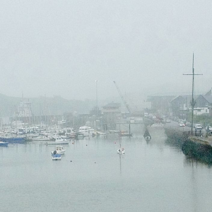 Photograph of a foggy harbor