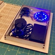 Detailed view of lit-up microcontroller with blue lights